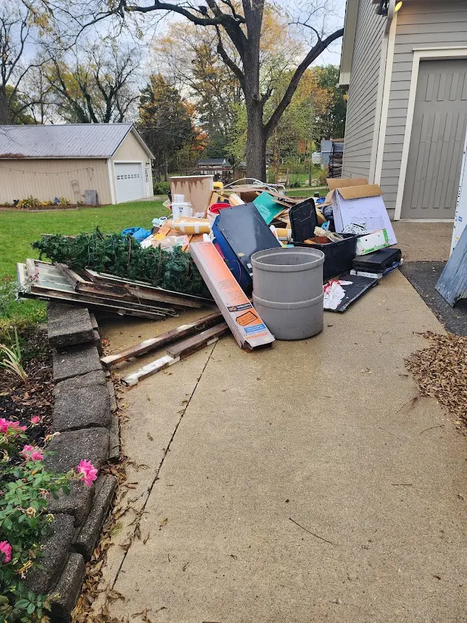Dumpster being loaded with debris for Commercial Dumpster Rental in North Auburn